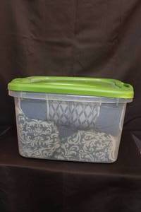 lot 200 image: Tote full of throw pillows and shams and extra buttons see all pictures