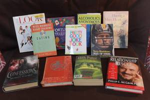 lot 256 image: collection of various books spanning different genres, including self-help, humor, biography, and fiction. See picture for titles