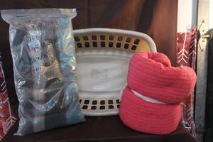 lot 273 image: Laundry basket with red throw and blanket thats 50x60