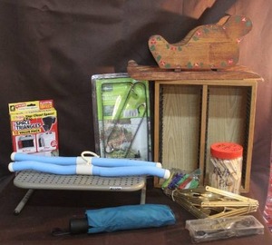 lot 299 image: household items,including Plate Hangers. Umbrella clothespins and more see pictures