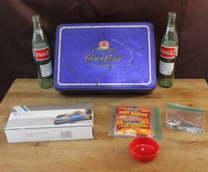 lot 312 image: Mixed lot BodyMed Blue Vinyl Cold Pack,hand warmers fingernail kit  vintage Crown Royal tin box and more see pictures