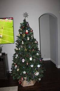 lot 83 image: 7.5 ft. Prelist Christmas tree with quilted tree skirt (not the ornaments)