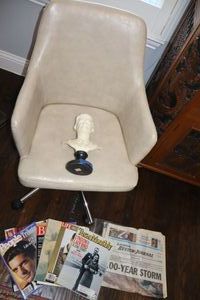 lot 22 image: Safavieh Rolling tulip style chair, JFK bust statue and magazinenewspaper articles
