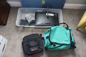 lot 145 image: Lenovo monitor, keyboard and mouse plus duffle bag and Globus travel bag