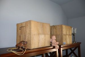 lot 140 image: Home dcor square woven native style storage bins, Zippered frog bag, cherub figurine, and more