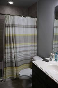 lot 125 image: Bathroom contents See all photos,  bathroom with yellow and grey curtain