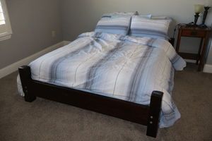 lot 129 image: Hand made Wood Full size bed frame (mattress and bedding available)