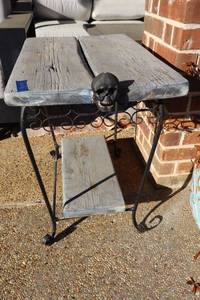 lot 158 image: Patio side table with skull ornament