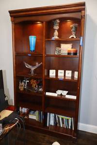 lot 20 image: Lighted bookshelf only - 48W x 18D x 84H. Top 2 shelves on each side are glass. Has touch onoff feature.