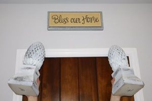 lot 23 image: Home dcor - Bless Our Home sign and wood pineapple finials