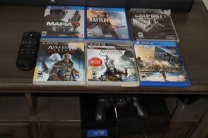 lot 38 image: Sony PlayStation 4 and video games as shown