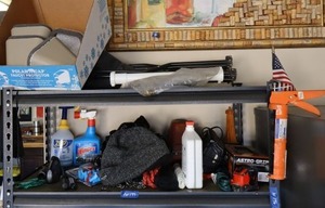 lot 177 image: Folding travel chair, outdoor  faucet covers, trash bags, tools, wooden Eiffel tower puzzle