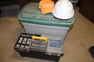 lot 245 image: Black plastic toolbox with tools, garden tools and hard hat