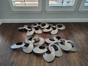 lot 12 image: 2 part metal wall art hanging, see all photos. Each piece is a little over 5 long (has been removed from the wall)