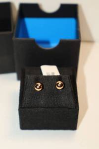 lot 13 image: Orb earrings - earring back marked 14K and not magnetic