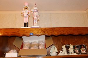 lot 31 image: Pink nutcrackers, pink Lenox ornaments, Snowbabies figurines and glass ornaments