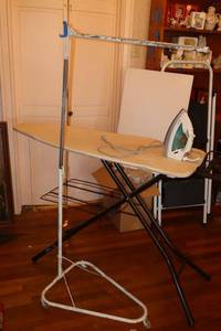 lot 54 image: Vintage rolling clothes rack with ironing board and iron
