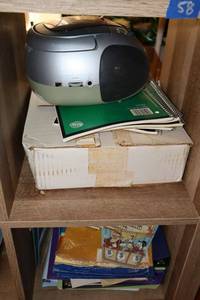lot 58 image: Portable CD player (needs cord), and notebooks