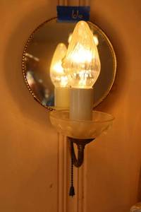 lot 66 image: Pair of wall mirrored sconces with pull string (must bring tools to remove)