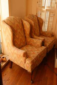 lot 69 image: Pair of wingback armchairs