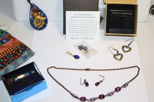 lot 104 image: Jewelry Blue lapis Earrings, blue and gold pendant necklace, purple bead necklace and earring set