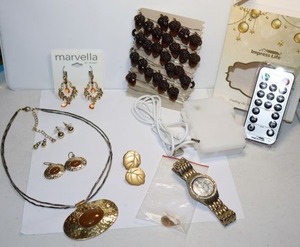 lot 112 image: Jewelry Brown bead jewelry, acorn LED string lights, leaf earrings and watch