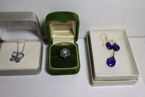 lot 119 image: Jewelry Blue Lapiz Earrings and pendant (marked 925), blue stone cluster ring, and opal butterfly necklace