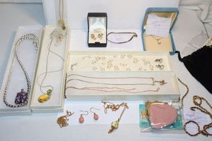 lot 121 image: Jewelry Easter egg jewelry, opal necklace marked CID 14K, and more