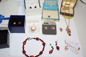 lot 125 image: Jewelry Rose gold ring, Strawberry Shortcake pendant, purple stone earrings and more