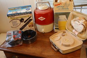 lot 195 image: Vintage drink coolers, vintage hair dryer, garage door seal, dryer lint removal kit