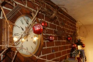 lot 190 image: Wall clock and hurricane lamp wall sconce