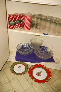lot 229 image: Christmas plates and glasses with candy stripe candles