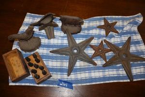 lot 264 image: Cast iron stars and door stops plus vintage steel number stamps