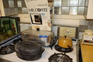 lot 248 image: Vintage roasting pans, fondue pot, and Coffee maker