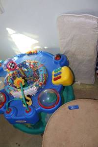 lot 283 image: Vintage Tomlinson swivel seat, kids bouncy seat, and crib cushion