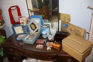 lot 330 image: Estee Lauder gifts, cross-stitch fabric, craft organizer, purple ceramic rose and more