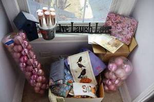lot 321 image: Pink ornaments, birdhouse, Live-Love Laugh sign, and craft items