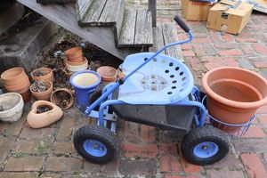 lot 353 image: Blue rolling garden cart and plant pots as shown