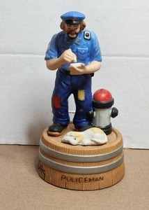 lot 146 image: Vintage Emmett Kelly Jr Flambro Porcelain Clown Figurine - Weary Willie-Policeman - Music Box - wood stand - signed and dated