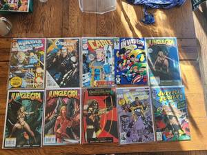 lot 169 image: Selection of vintage comics - Marvel & DC - Cable, The Invaders, Jungle Girl, Green Arrow, Cage, Justice Society