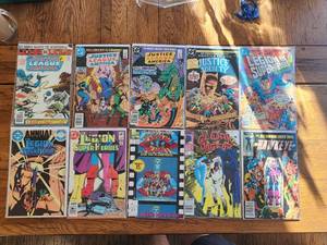 lot 170 image: Selection of vintage comics - Marvel & DC - Justice League America, Justice Society, Captain Planet, Cloak and Dagger, Hawkeye