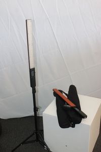 lot 8 image: Yongnuo YN360 RGB LED VideoPhoto Light Wands with Adjustable 3200K-5500K Coloir Temp also An Orange Filter 3200K and One Stand.  One Battery Included as well as Carrying Cases. See Photos