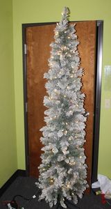 lot 23 image: Ultra Slim Flocked Brewster Pine, Pre-lit LED Indoor Christmas Tree in Original Box,