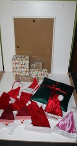 lot 44 image: Christmas Decorations, several Santa hats, stocking, pillow, Poster size White Frame, and more