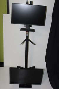 lot 85 image: Computer Monitors and Stand, also tv with dvd player that has a broken screen