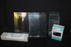 lot 98 image: Plexiglass document holder, Plexiglass Flyer Holder, Binder Clips and Door Handle