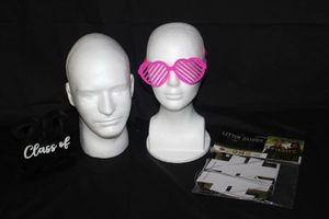 lot 99 image: Two Styrofoam Heads, Male and Female, Pink Glasses, #done banner and class of 23 decor