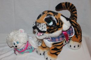 lot 134 image: Interactive tiger and little white dog