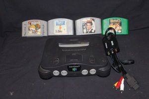 lot 143 image: Nintendo 64 with 4 games, has cords, no controllers
