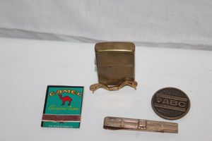 lot 159 image: Vintage Zippo, book of matches Bowling coin and Tie Clip